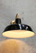 black shade on polished brass wall sconce