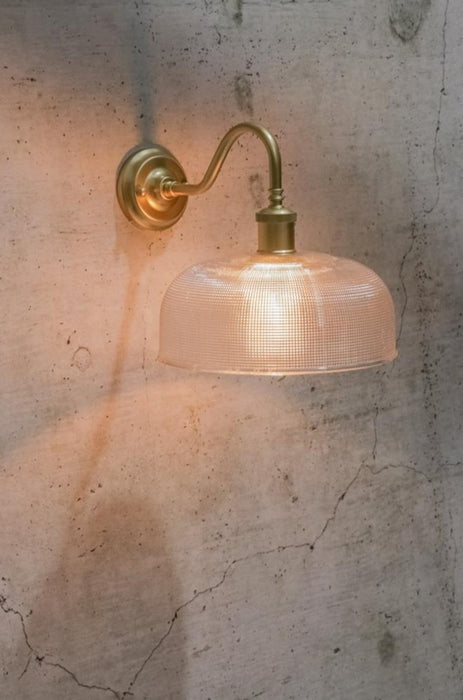 Large clear glass wall light with gold/ brass sconce