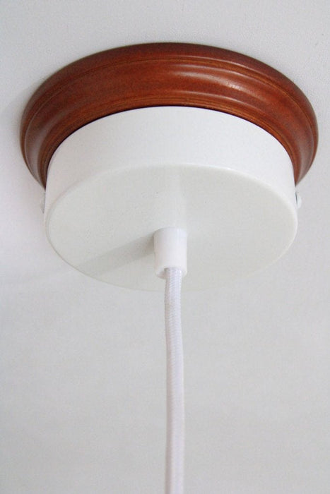White ceiling rose with wooden block