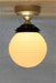 Small ridged glass ball batten light with gold finish