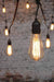 Edison light globes squirrel cage filament bulbs on a set of festoon string lights outdoor string lights