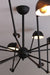 Industrial spider chandelier creates a unique lighting statement.