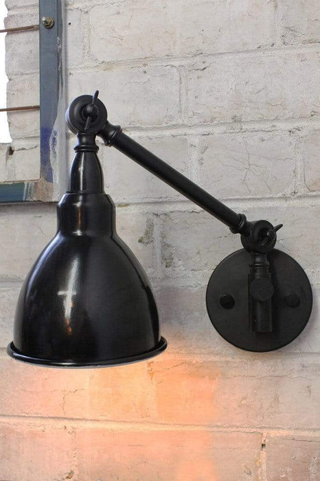 Industrial swing arm wall lamp with black enamel shade