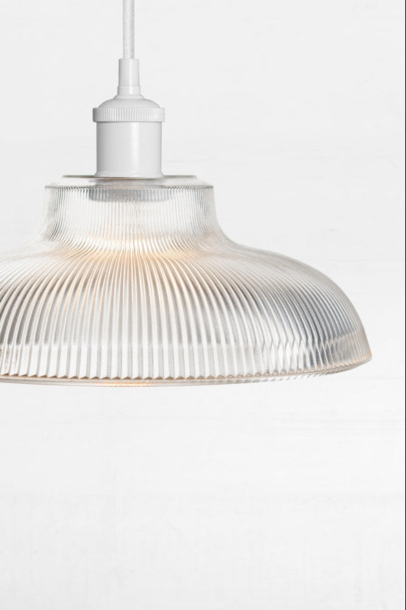 Sur clear reeded glass on a white lampholder.