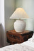 ceramic table lamp sandstone and paired with a fabric drum shade with a natural flax finish.