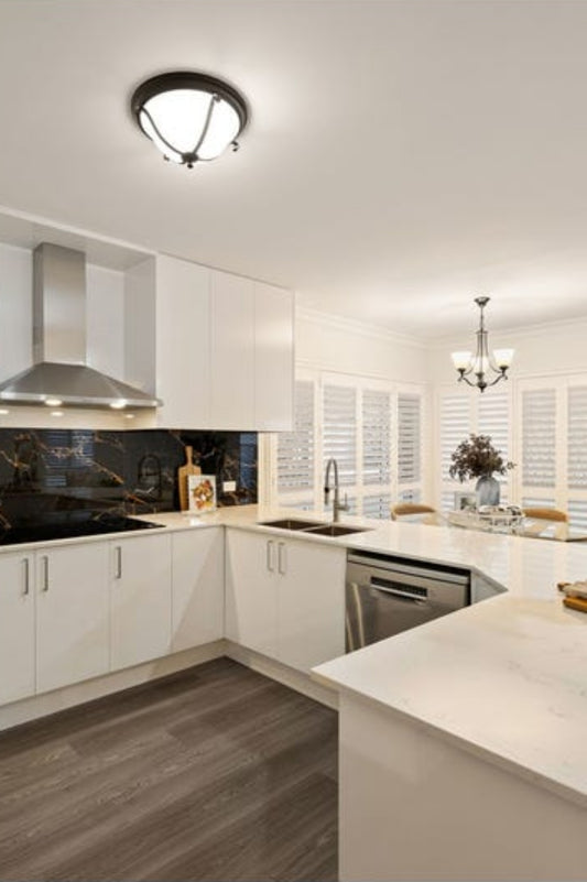 Metal and glass ceiling light in a kitchen. 