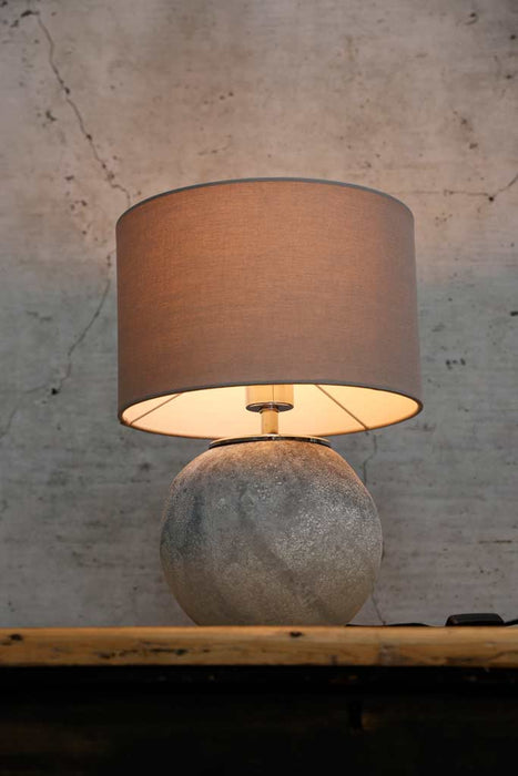 glass table lamp with grey fabric drum shade