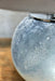 Silvery grey glass spherical base with chrome metalware