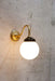 Glass Ball wall light in gold steel finish