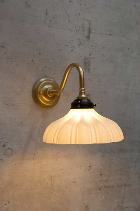 mayflower shade on a gold steel gooseneck sconce arm
