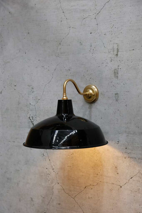 black shade on polished brass wall sconce