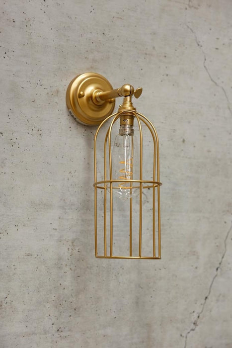 Long cage wall light in gold/brass with short gold/brass wall arm