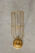 Long cage wall light in gold/brass with short gold/brass wall arm