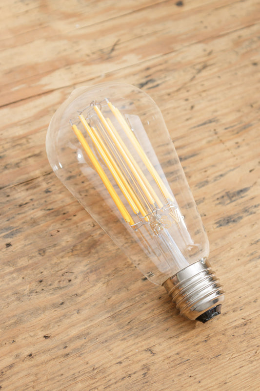 ST64 clear bulb with LED filaments and a base type of E27.