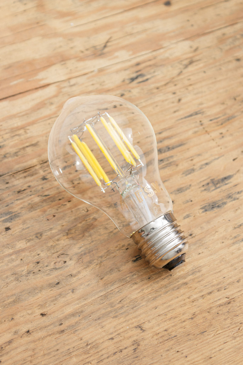 Clear glass bulb with an E27 base type and LED filaments. 