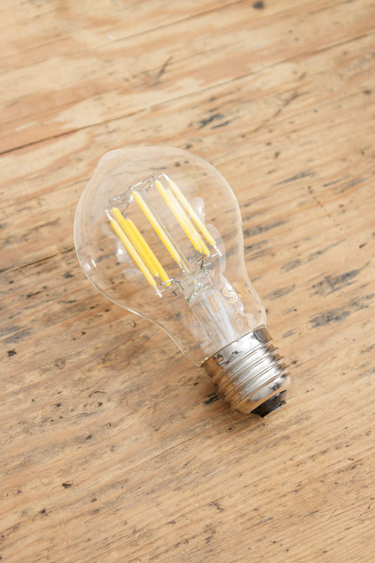 Clear glass bulb with an E27 base type and LED filaments. 