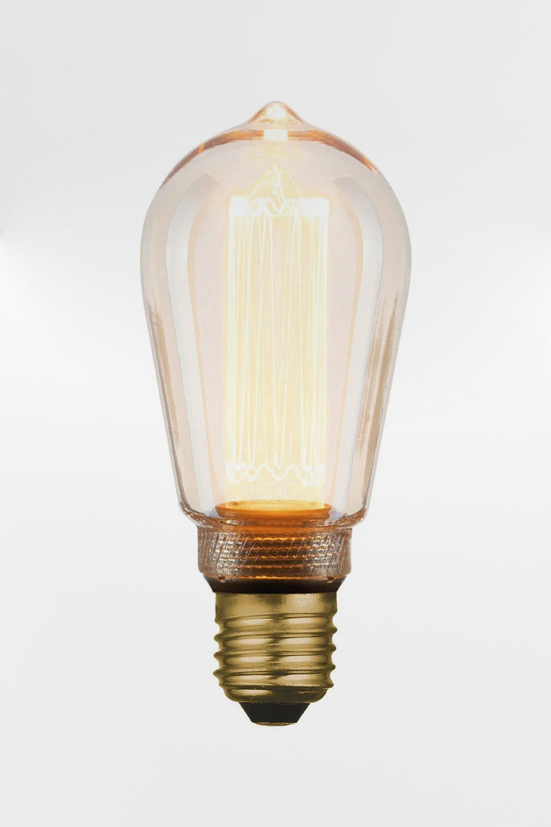 Laser-cut filament amber teardrop LED bulb with E27 base. 