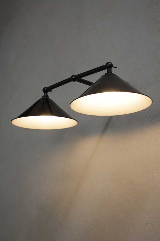 Double wall light fixture on a gray wall
