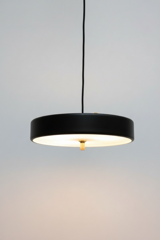 Pendant light with black finish and gold/brass metalware and frosted diffuser