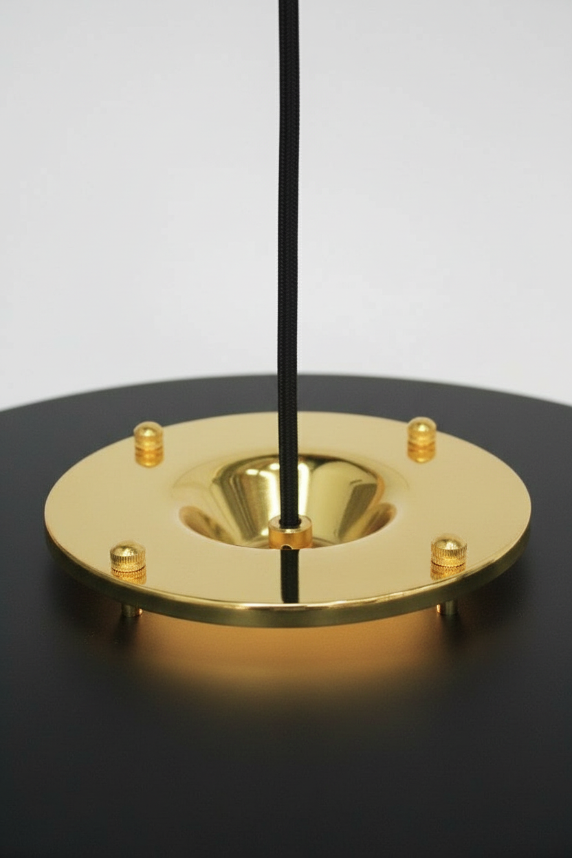 Gold/brass metalware with black pendant cord