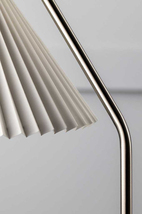 Close-up view of the brushed Nickel steel frame of the Bradhurst table lamp, showcasing its classic design.