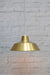 Bright brass pendant light with round white cord