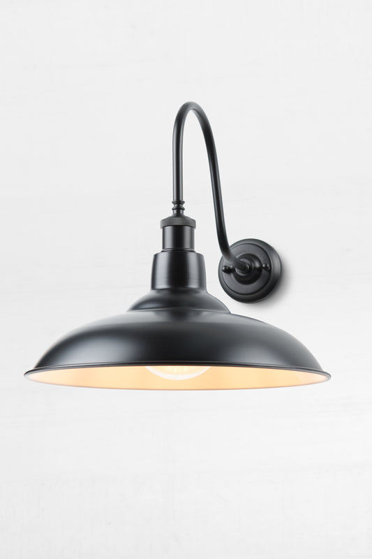 Black metal shade with an extra large gooseneck outdoor wall sconce.