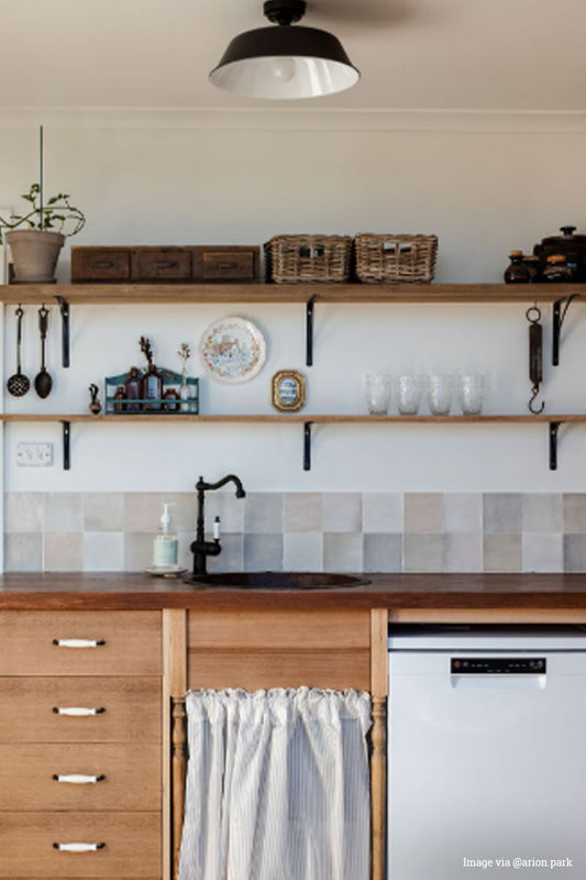 Black metal shade with white inner in a modern farmhouse style kitchenette.