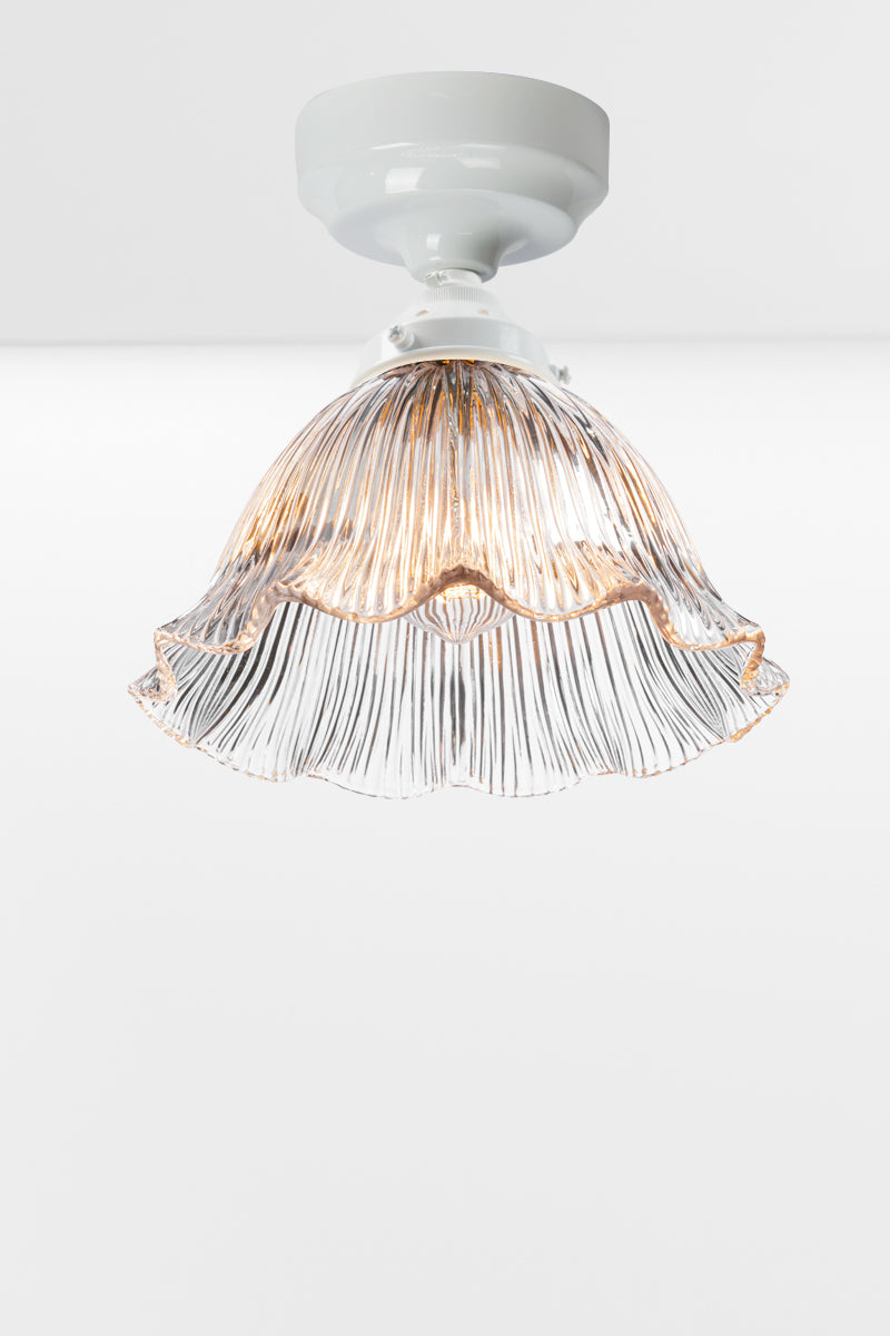 Holophane clear shade with a frilled edge paired with a whitebatten holder. 