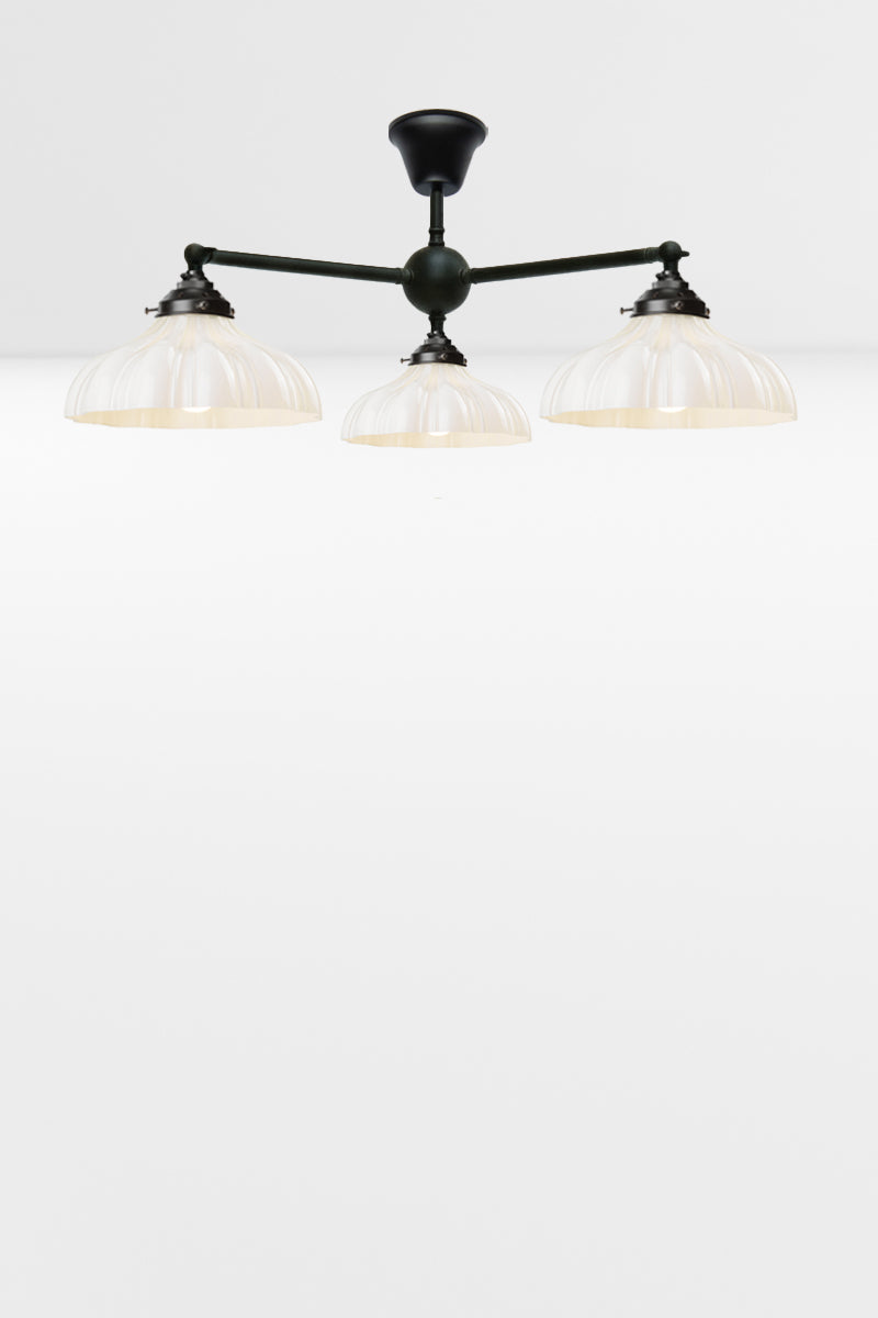 3 arm adjustable flush mount light with three opal glass shades. 