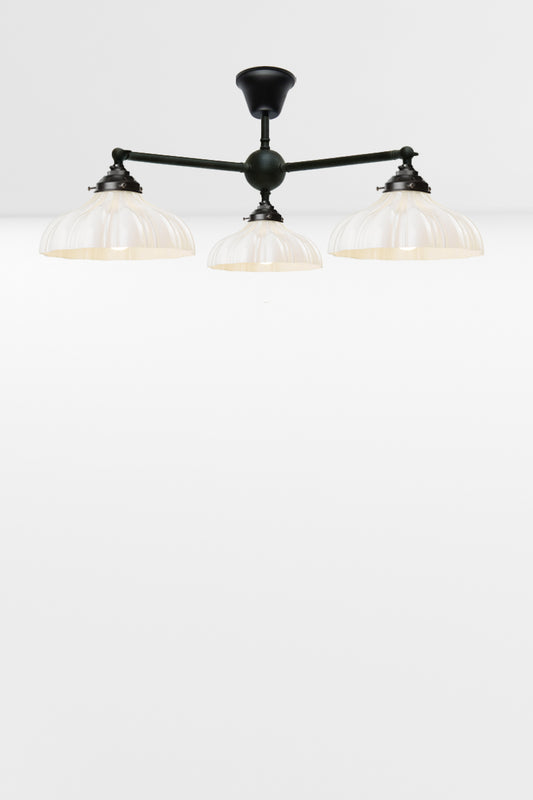 3 arm adjustable flush mount light with three opal glass shades. 