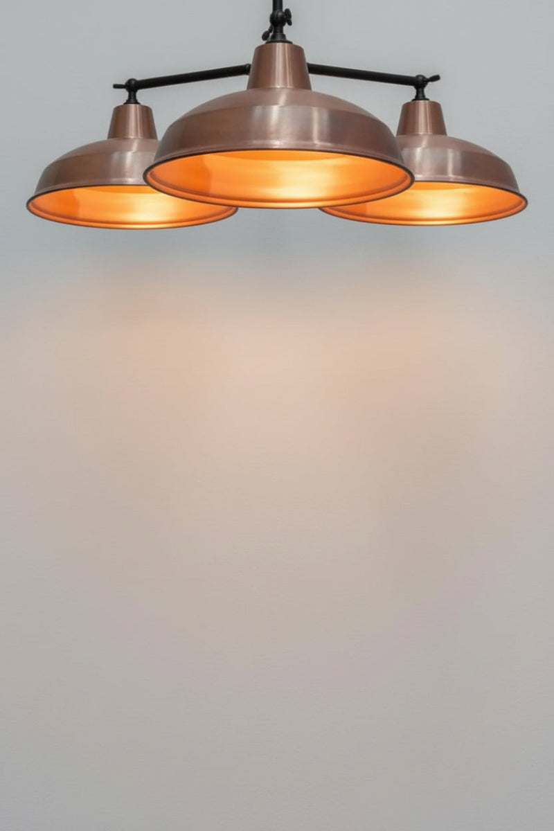 Warehouse flush mount with black arms and copper shades.