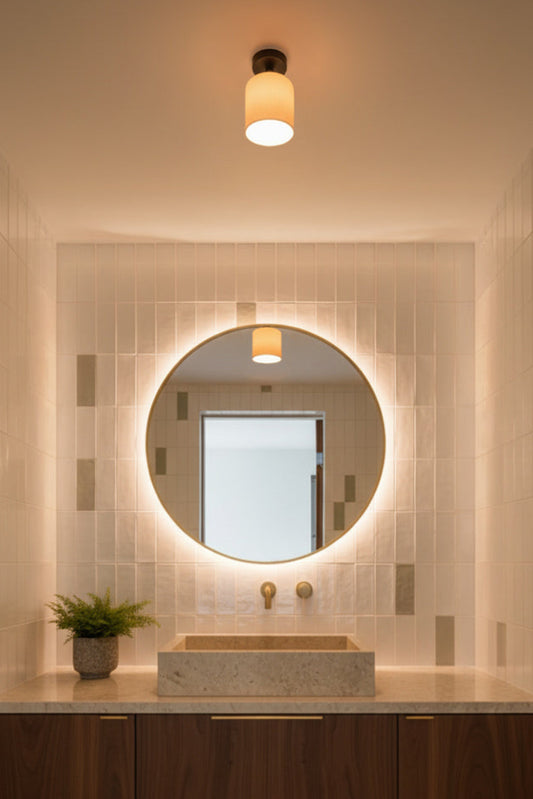 Bathroom vanity with round mirror and ceramic lighting fixture