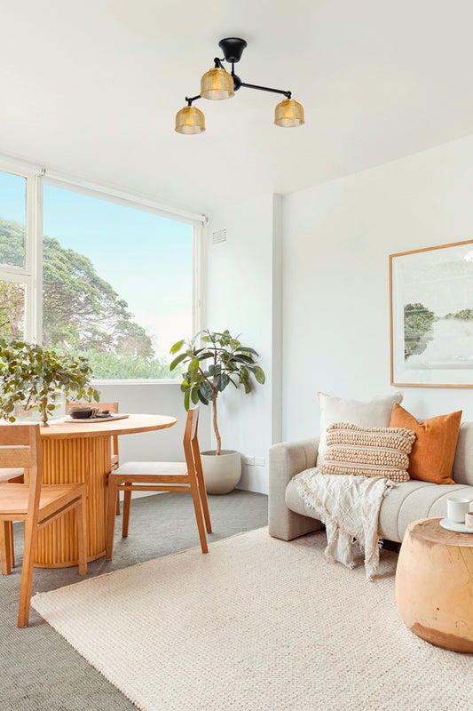 Chapman Glass Chandelier black frame clear shades in living room