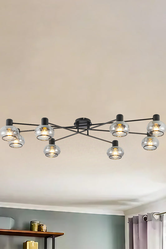 8 light ceiling light in black with glass shades in a lounge room