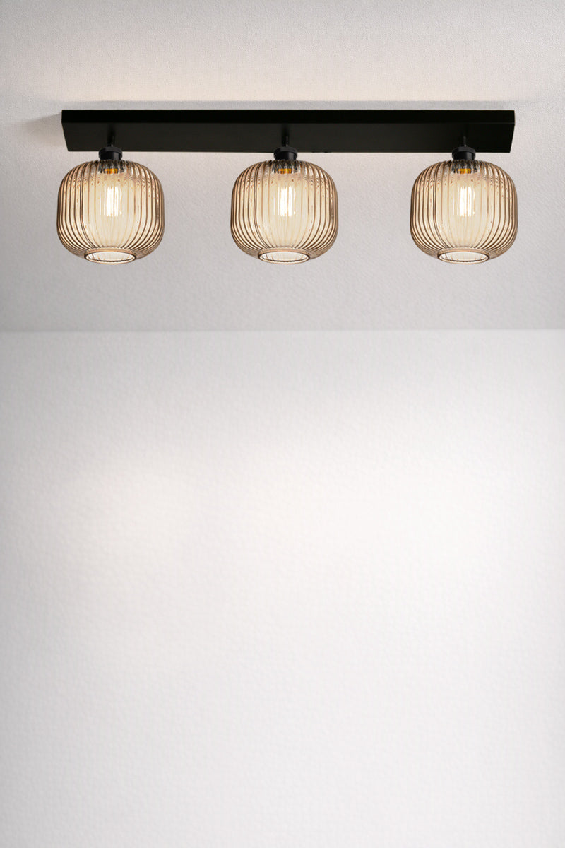 Balmain Reeded Glass 3 Light Flush Mount with amber glass shades and black ceiling mount