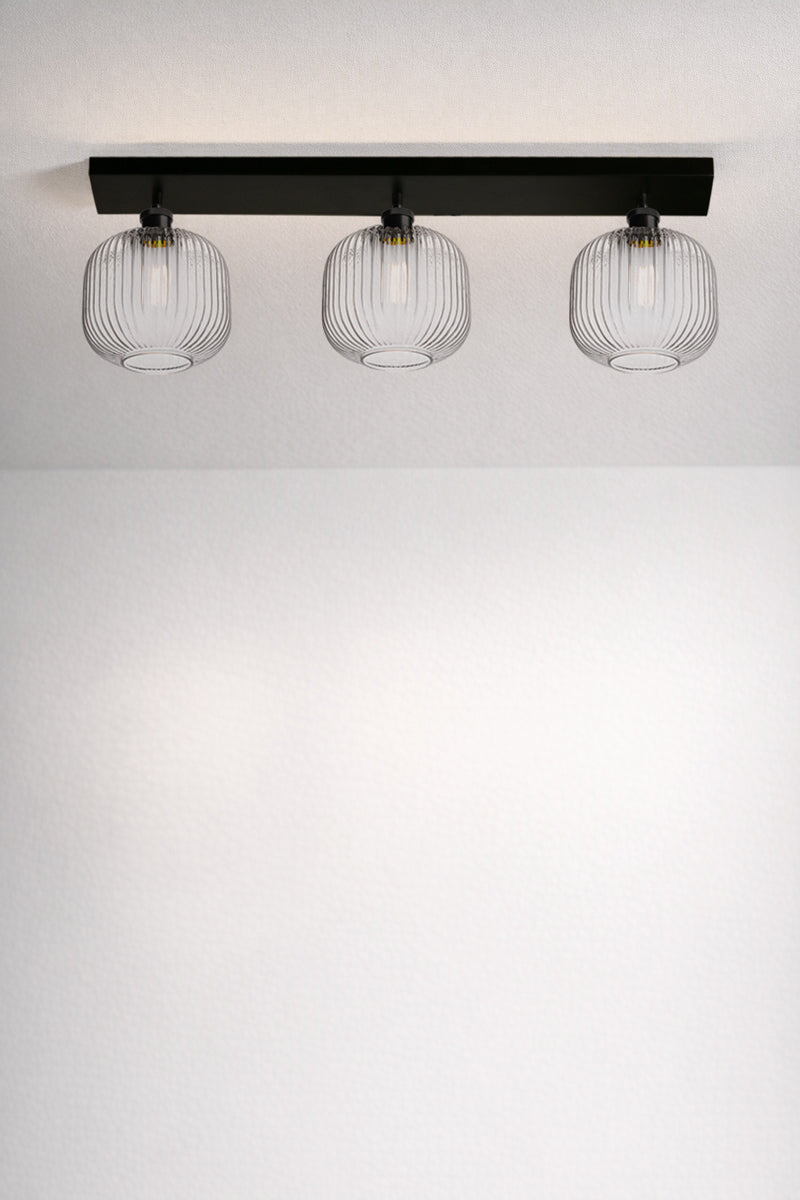 Balmain Reeded Glass 3 Light Flush Mount with clear glass shades and black ceiling mount