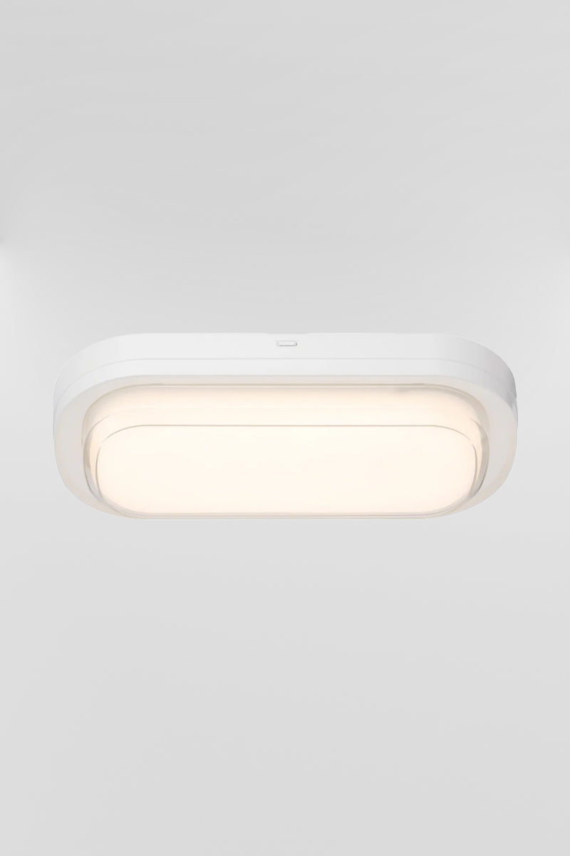 Top view of the white framed polycarbonate rectanguler bunker light, with the LED light source turned on.  