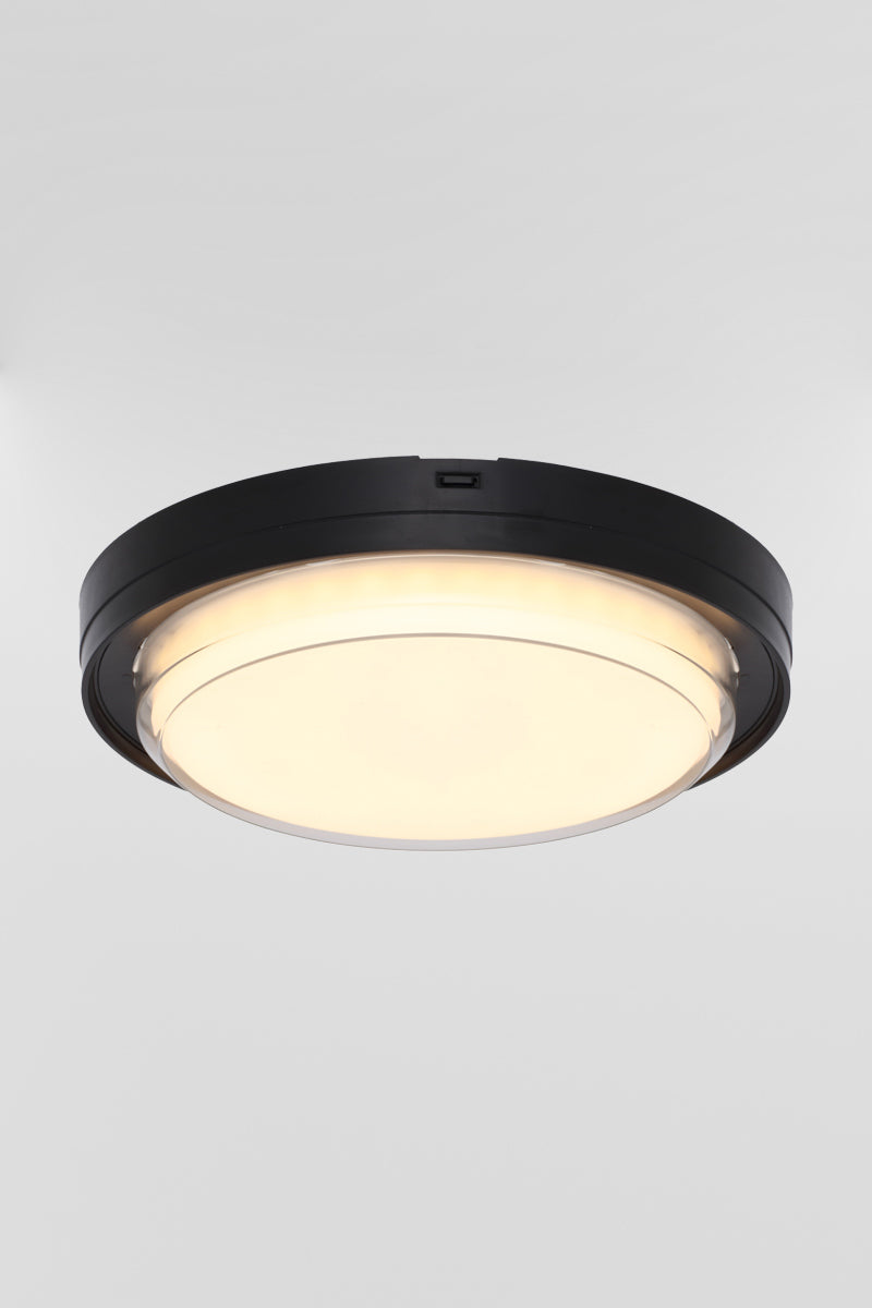 Side view of the round polycarbonate bunker light with black frame and LED light source. 