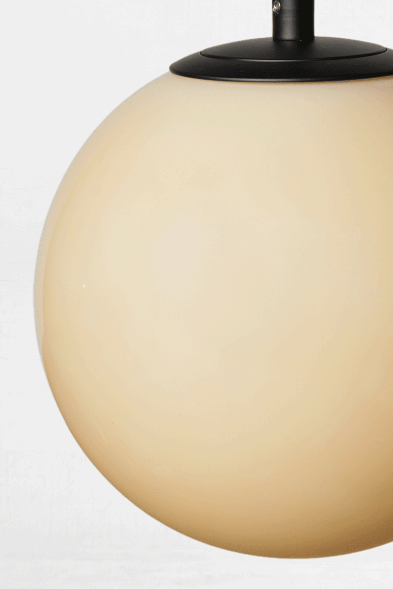 GIF of the hue change on the Amber glass orb shade when illuminated. 