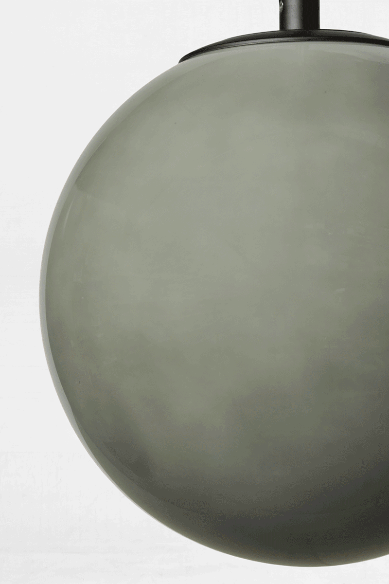 GIF of the hue change on the Light grey glass orb shade when illuminated. 