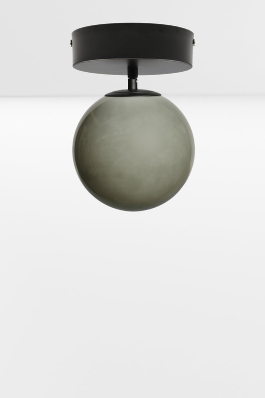 Light grey glass orb shade on a black batten holder. 