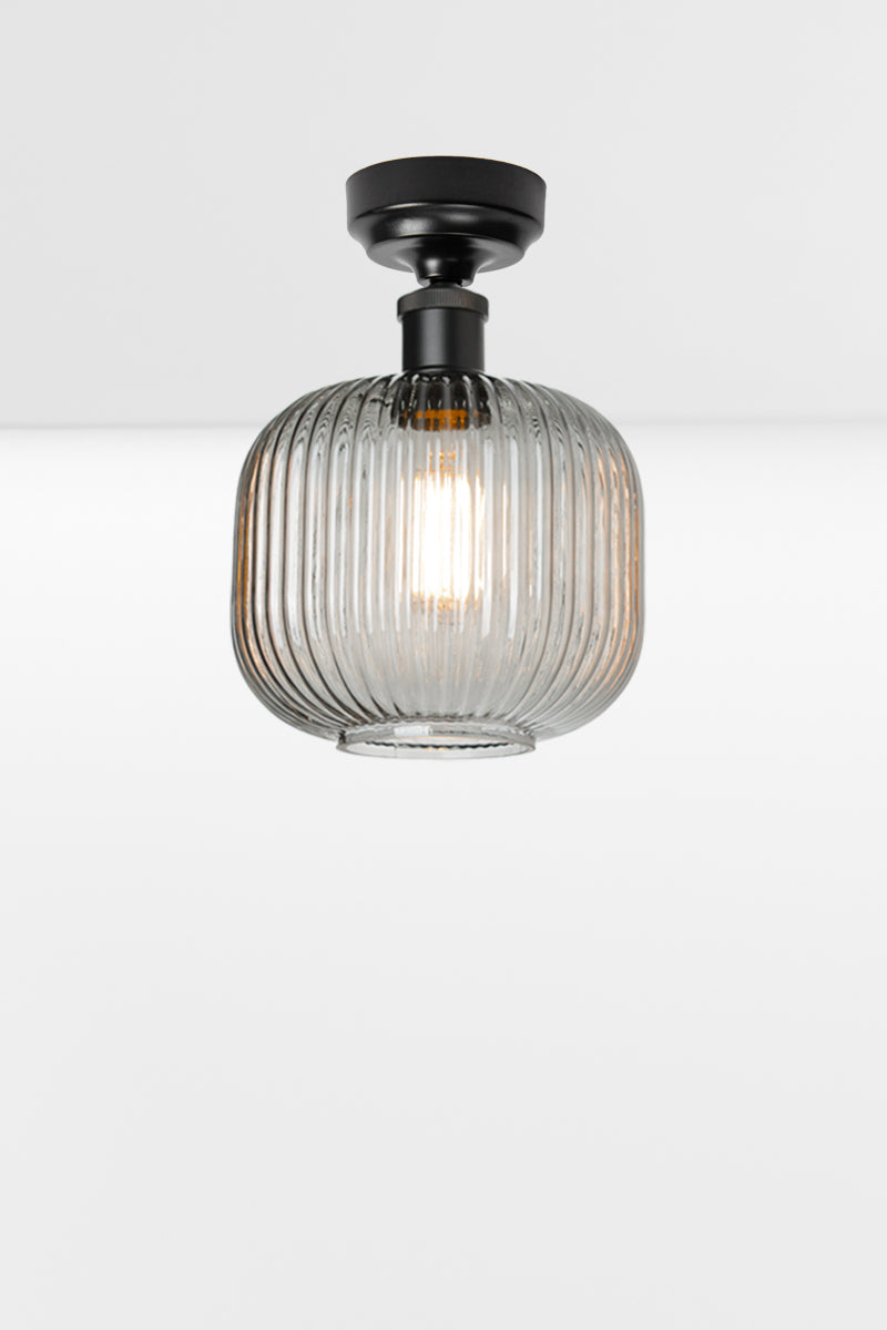 Grey reeded glass shade paired with a black batten holder. 