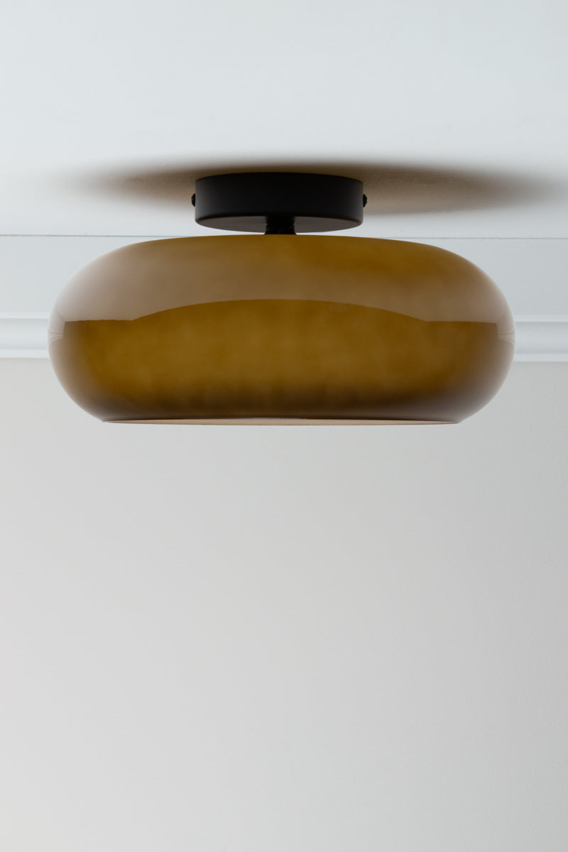 Avoca Glass Ceiling Light in sage green with rounded glossy glass shade and black ceiling fixture.
