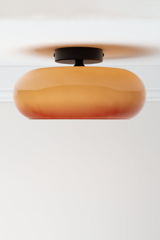 Brown Avoca Glass Ceiling Light with tonal glossy glass shade and black ceiling fixture.