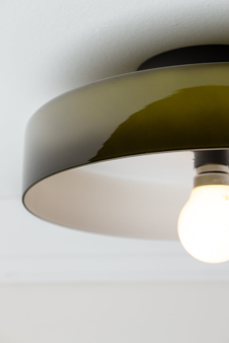 Close-up of Forest Gambier Glass Ceiling Light showing dark green glossy glass shade and white interior