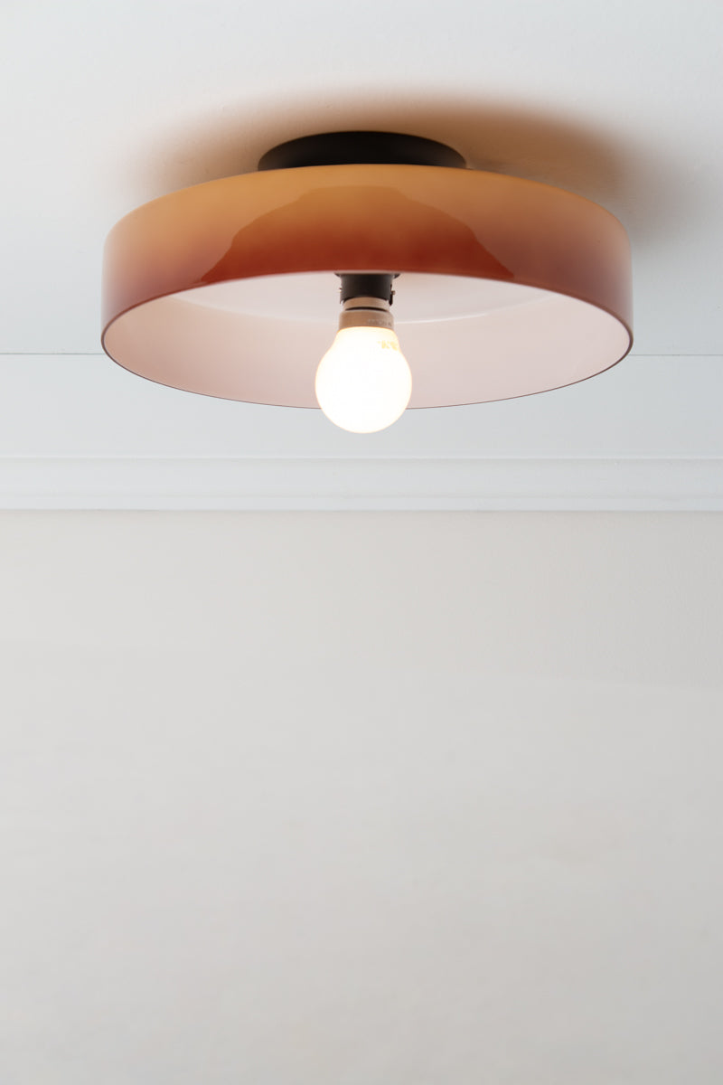 Brown Gambier Glass Ceiling Light with glossy low-profile shade, white interior and black ceiling fixture