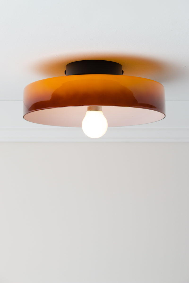 Amber Gambier Glass Ceiling Light with rich glossy glass shade, white interior and black ceiling fixture