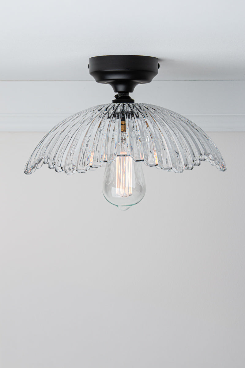 Hepburn Glass Ceiling Light with a black batten holder on a white ceiling. 