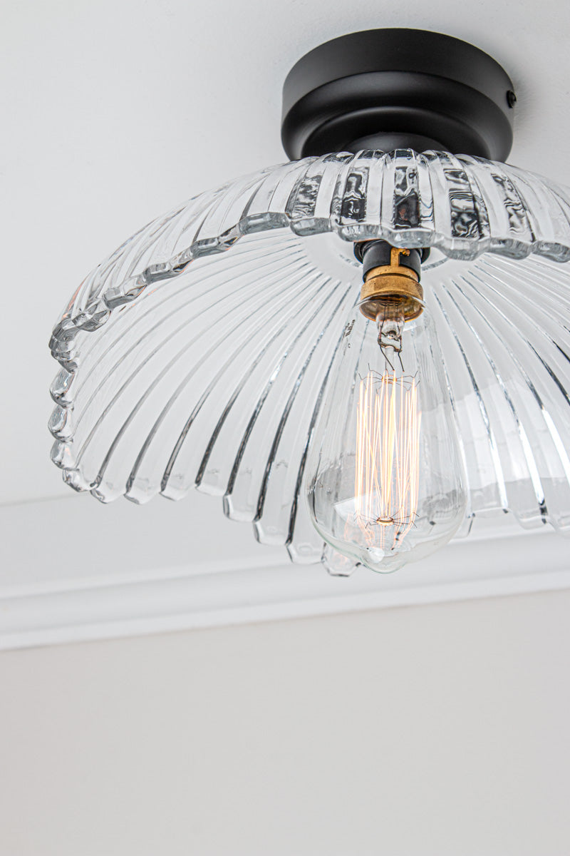 Close up of the Hepburn Glass Ceiling Light with a black batten holder on a white ceiling. 